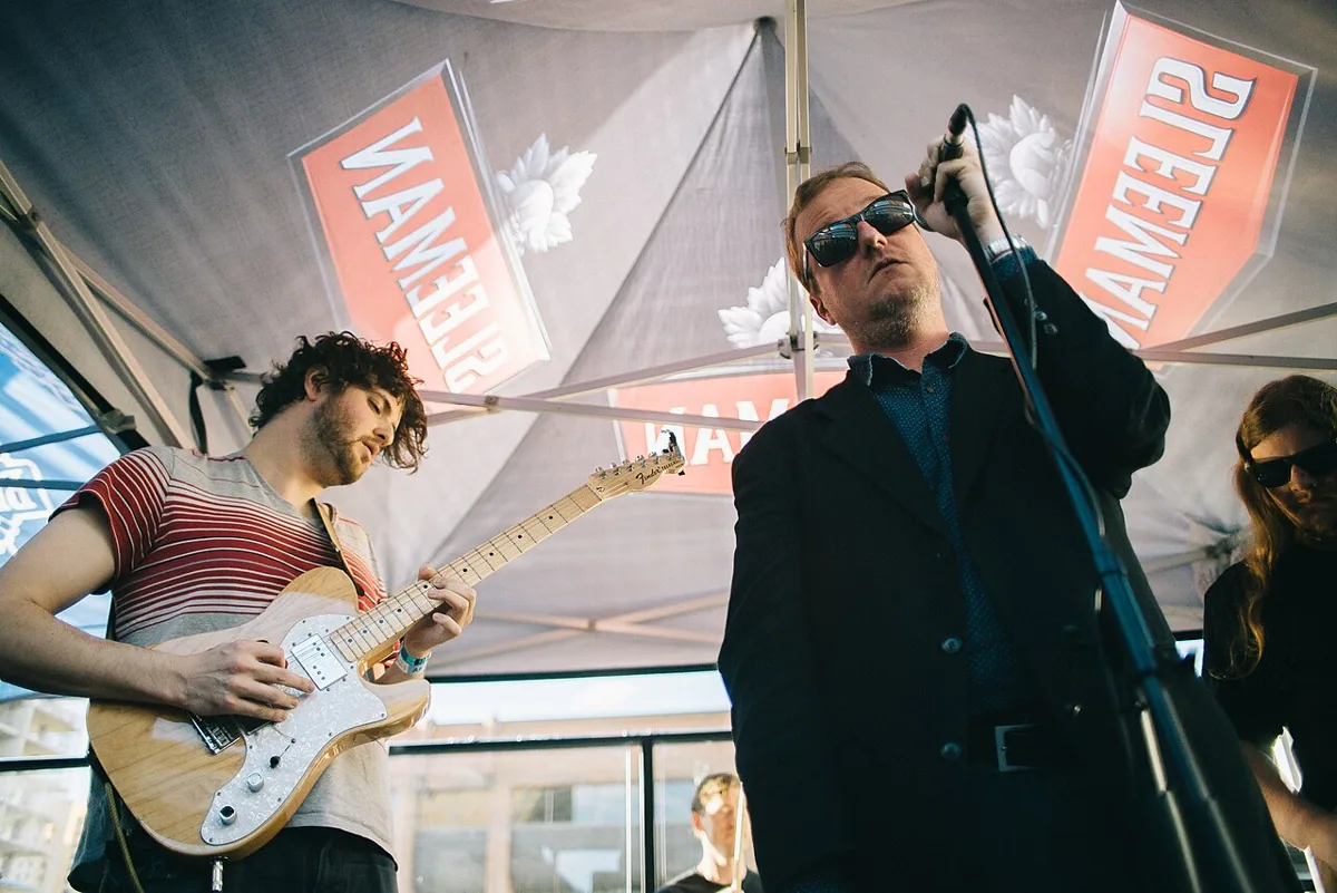 Protomartyr performing live in an archival photograph