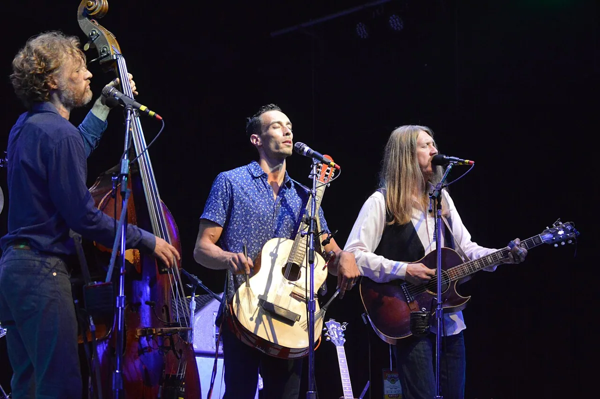 The Wood Brothers performing live in an archival photograph