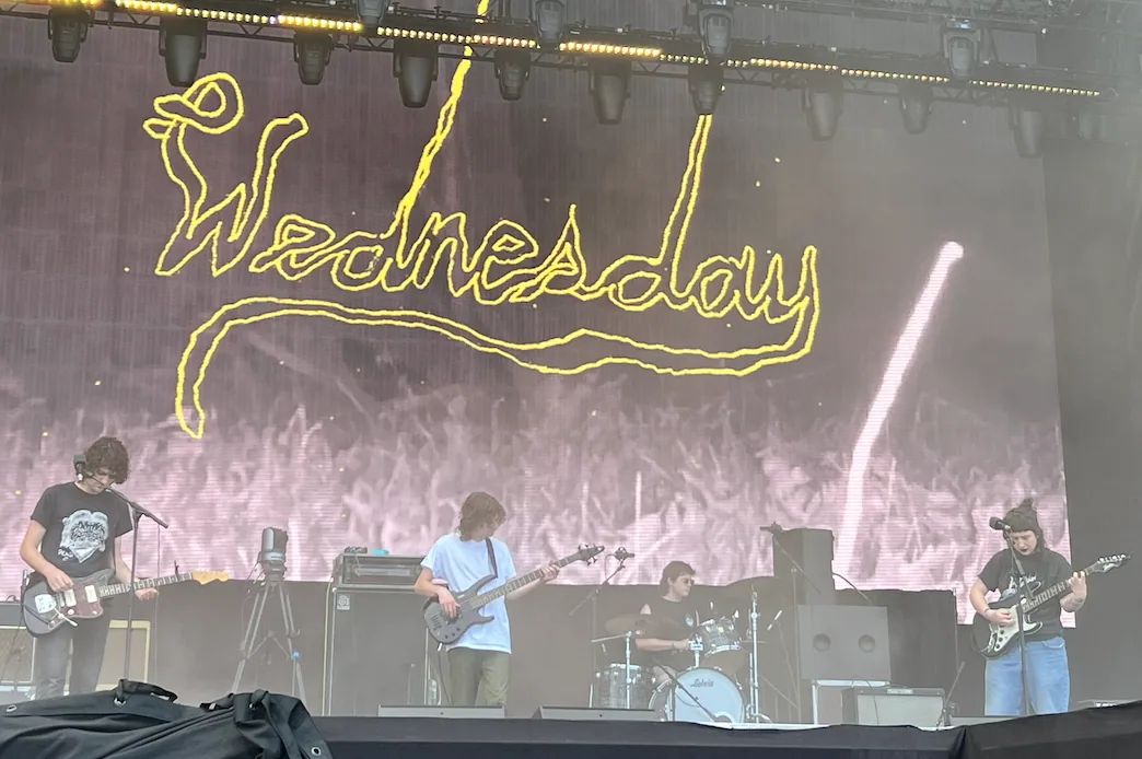Wednesday performing live in an archival photograph